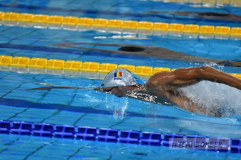 Adult practicing freestyle breathing in an Amsterdam pool, front crawl breathing technique.