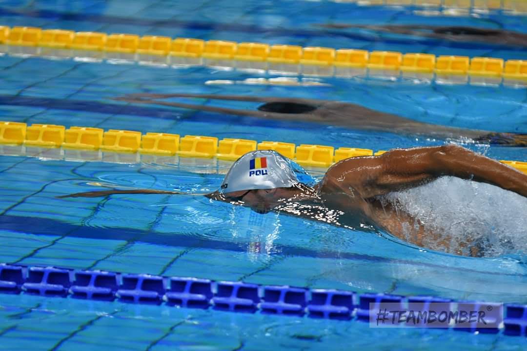 Adult practicing freestyle breathing in an Amsterdam pool, front crawl breathing technique.